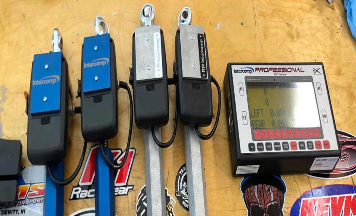 Intercomp racing scales and digital control display on workbench