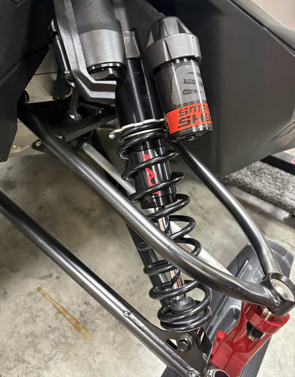 Close-up of snowmobile rear suspension coilover shock absorber