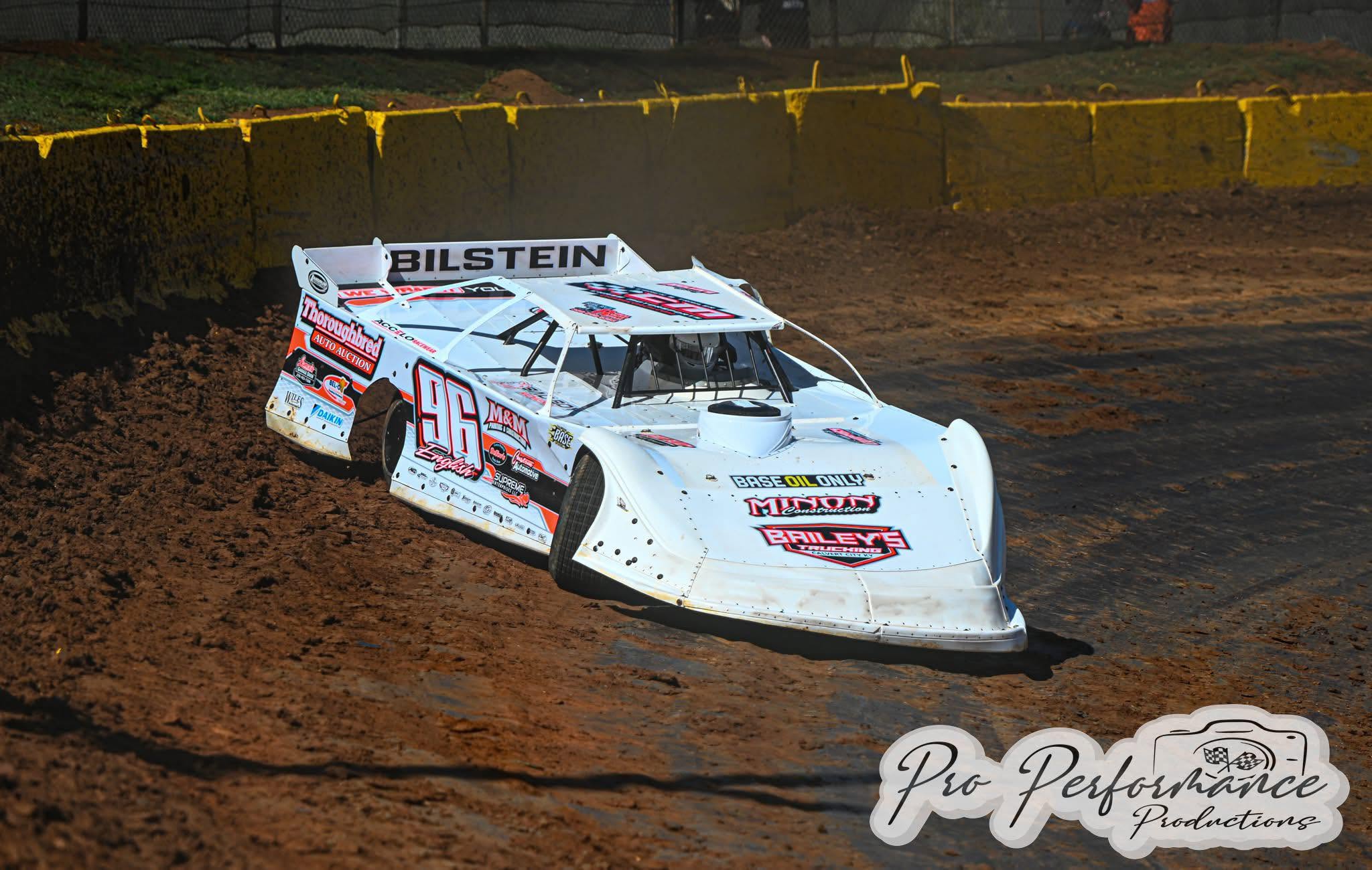 White number 96 dirt-track race car cornering